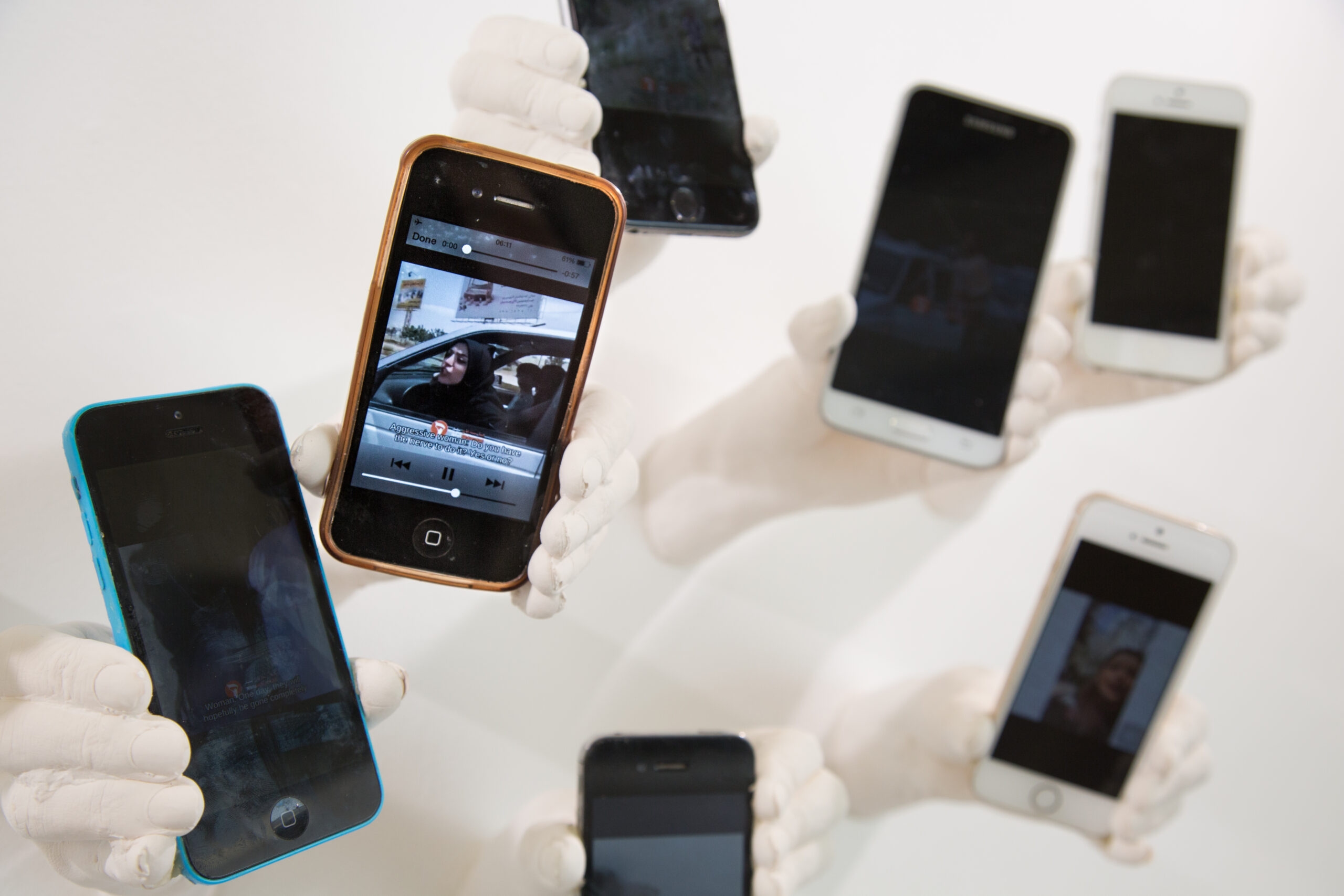 My Camera Is My Weapon (2018) [Plaster, mobile phones] Photography by Sian Wright