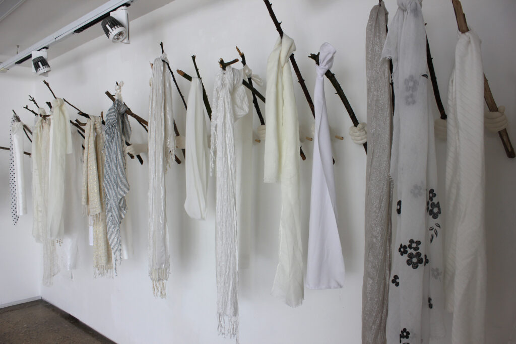 White Wednesdays (2018) [Plaster, sticks, headscarves]